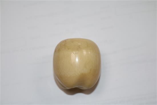 A Japanese ivory model of a fruit, with screw top